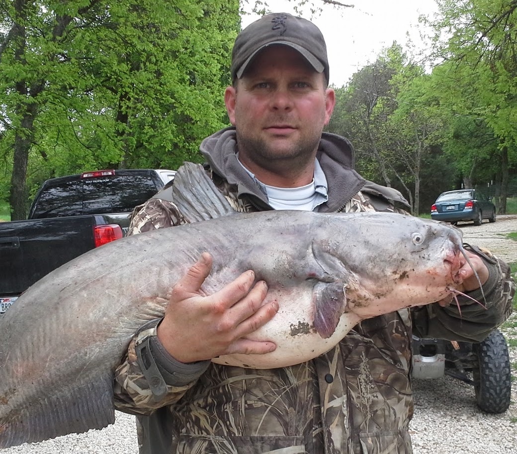 Man holding a trophy blue catfish caught on Lake Texoma