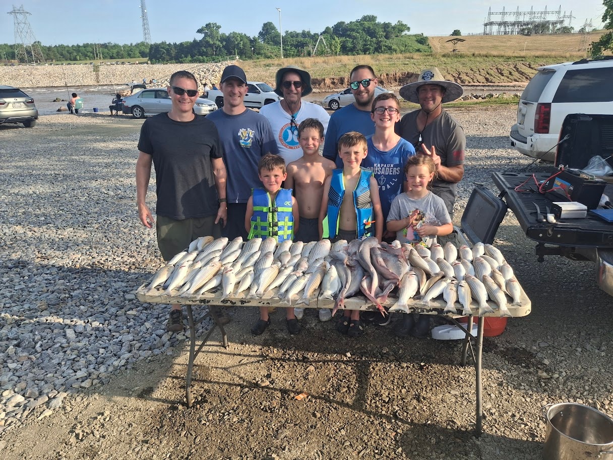 Family group with kids and a massive catch